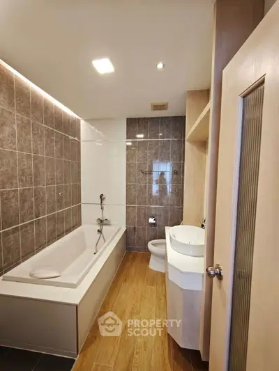 Modern bathroom with bathtub and stylish tile design