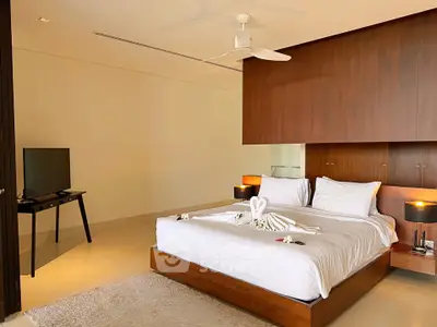 Luxurious modern bedroom with elegant decor and stylish furnishings, perfect for relaxation and comfort.