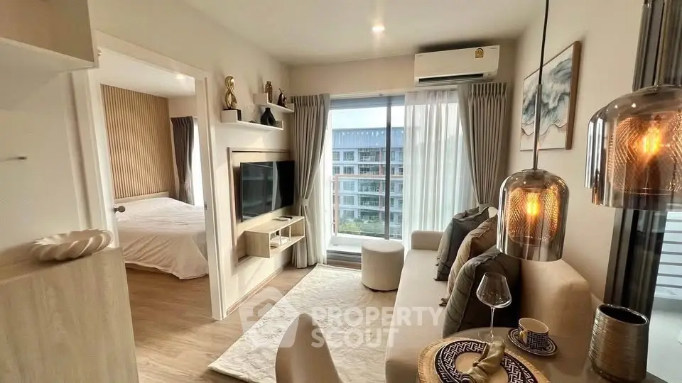 Modern living room with cozy decor and city view from balcony