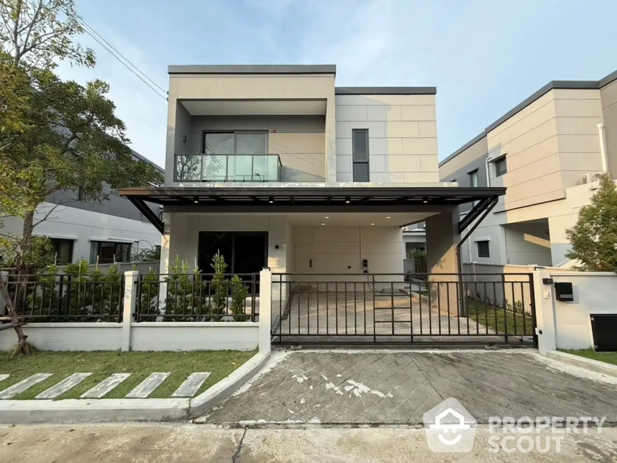 Modern two-story house with sleek design and spacious driveway