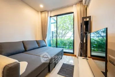 Modern living room with large window and stylish gray sofa in a cozy apartment.