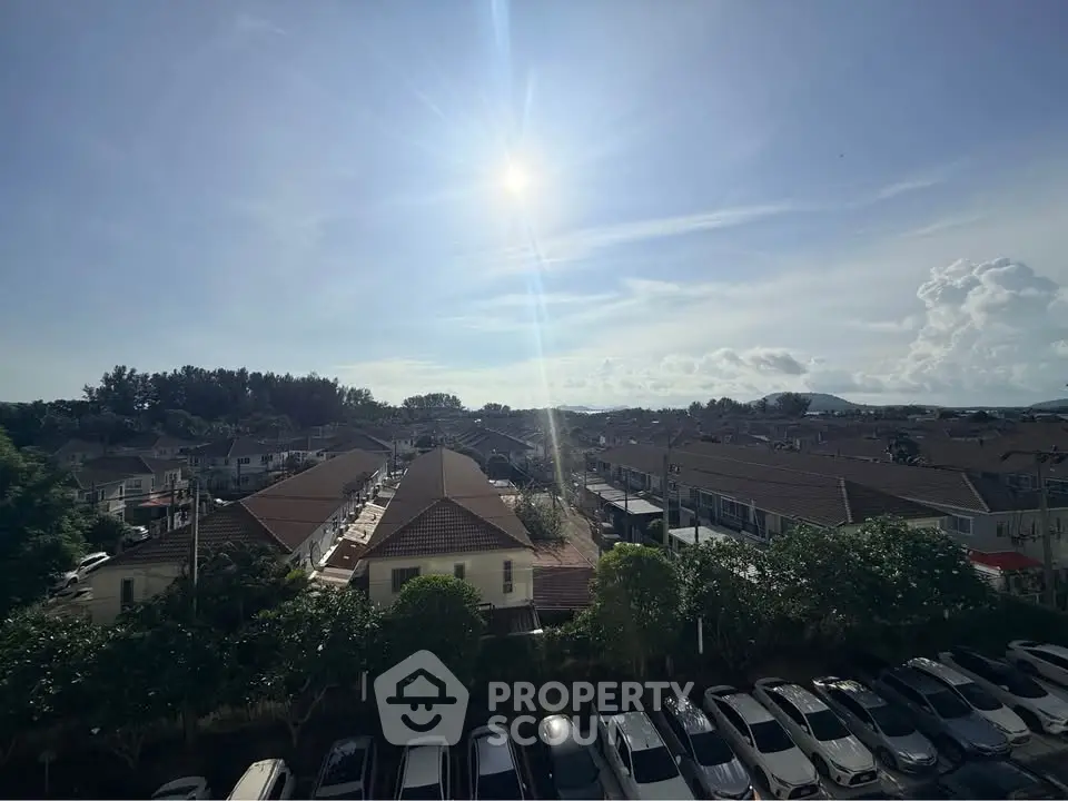Stunning aerial view of suburban neighborhood with clear skies and ample parking space.