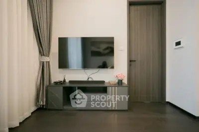 Modern living room with sleek TV setup and elegant decor
