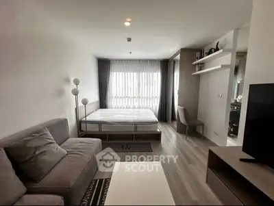 Modern studio apartment with cozy living area and stylish decor