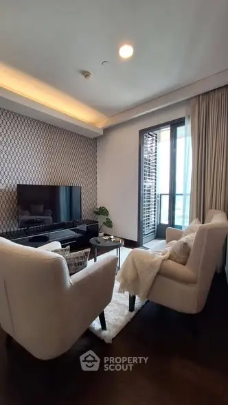 Modern living room with elegant decor and balcony access