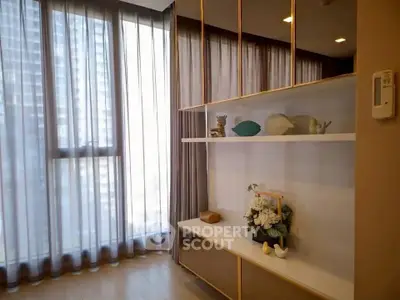 Stylish modern living room with elegant decor and floor-to-ceiling windows