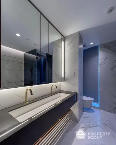 Luxurious modern bathroom with marble finishes and dual sinks