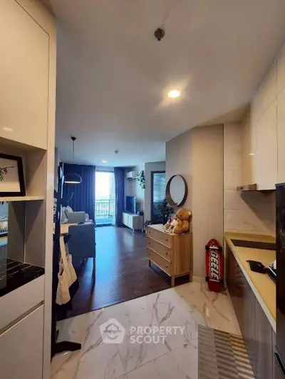 Modern open-layout living room with stylish decor and natural light