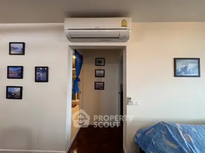 Cozy living room with air conditioning and framed wall art