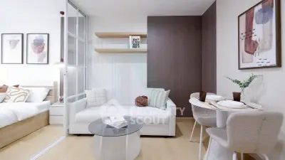 Modern living room with stylish decor and open layout adjacent to a cozy bedroom.