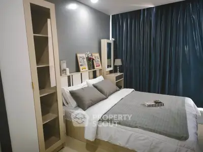Modern bedroom with stylish decor and cozy ambiance, featuring a comfortable bed and elegant furnishings.