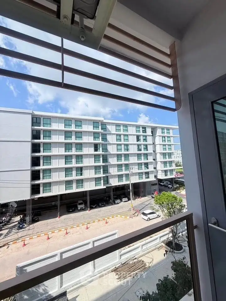 Modern apartment building view from balcony with clear blue sky