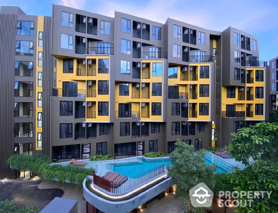 Modern apartment building with unique facade and pool view