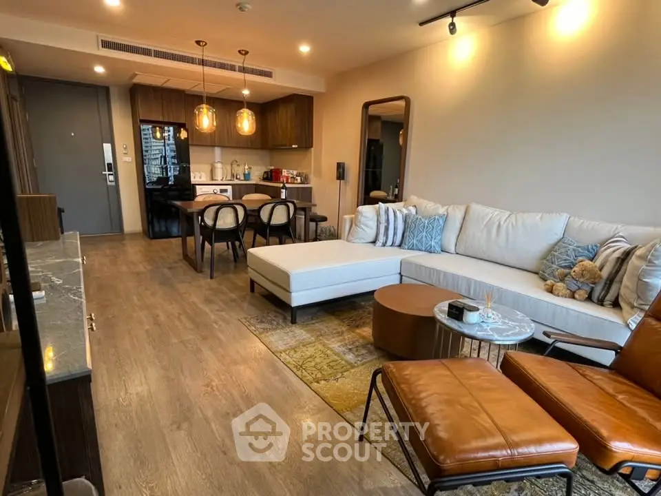Spacious modern living room with open kitchen and stylish decor