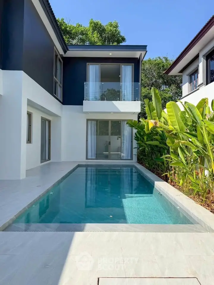 Luxurious modern villa with private pool and lush greenery, perfect for serene living.