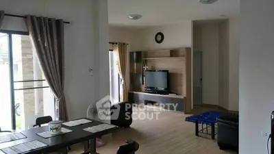 Spacious living room with modern decor and natural light