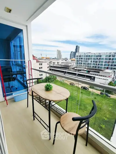 Charming balcony with city view, perfect for relaxation and enjoying the urban skyline.