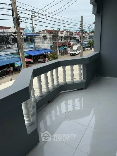 Spacious balcony with city view in a vibrant neighborhood, perfect for relaxation and enjoying the surroundings.