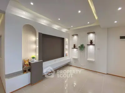 Modern living room with elegant lighting and stylish decor, perfect for contemporary living.