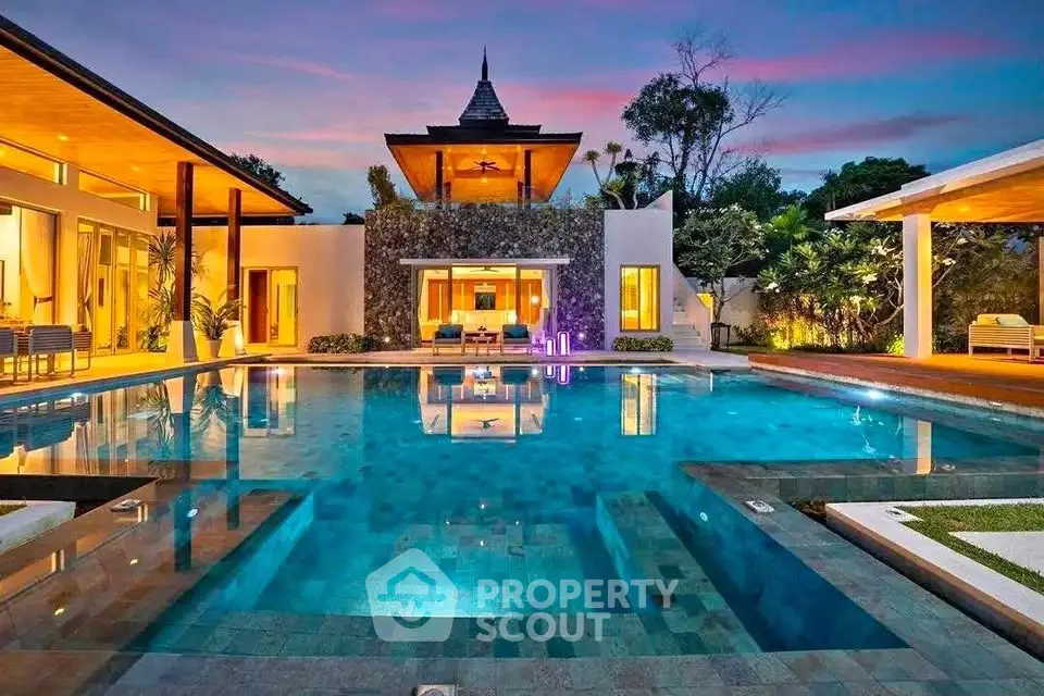 Luxurious villa with stunning pool and exotic architecture at sunset
