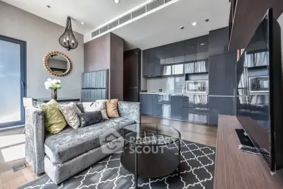 Luxurious modern living room with sleek kitchen, stylish decor, and ample natural light.