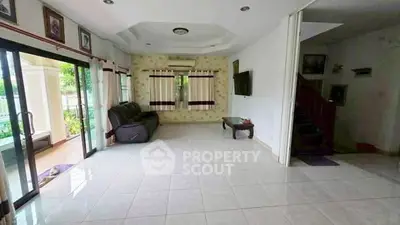 Spacious living room with sliding glass doors and modern decor