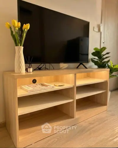Modern living room with stylish TV stand and vibrant decor