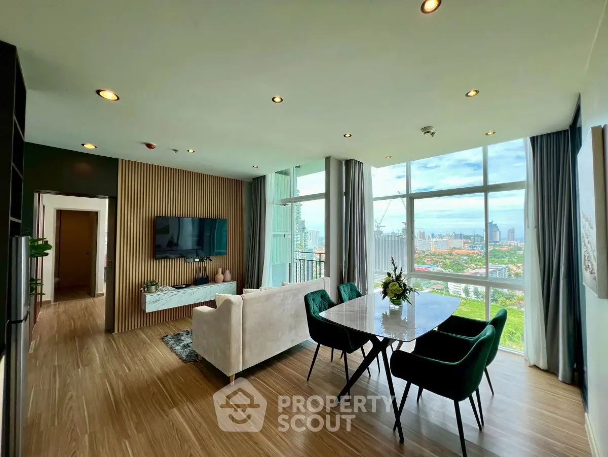 Luxurious living room with stunning city view and elegant dining area