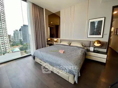 Luxurious bedroom with city view in modern high-rise apartment