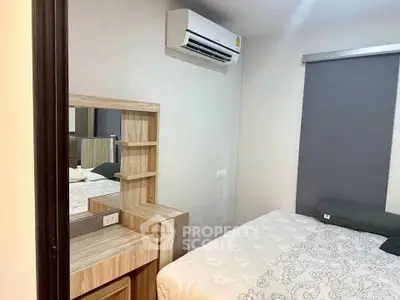 Cozy bedroom with air conditioning and stylish wooden furniture