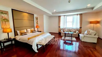 Luxurious bedroom with elegant decor and hardwood flooring