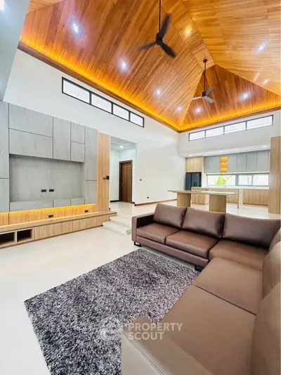 Luxurious modern living room with high wooden ceiling and stylish furniture