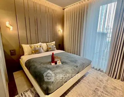 Luxurious bedroom with elegant decor and large window for natural light