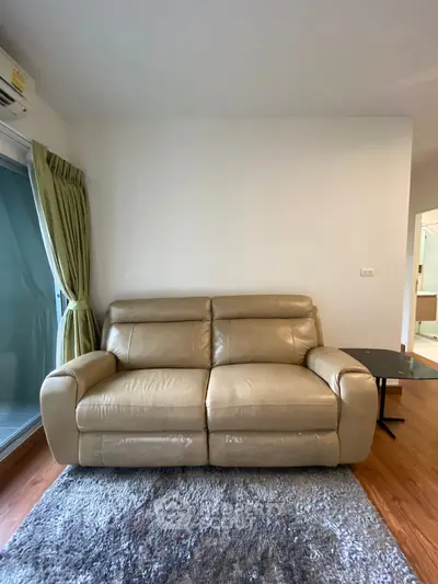 Cozy living room with leather sofa and modern decor