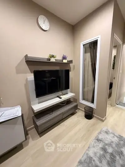 Modern living room with sleek TV unit and stylish decor