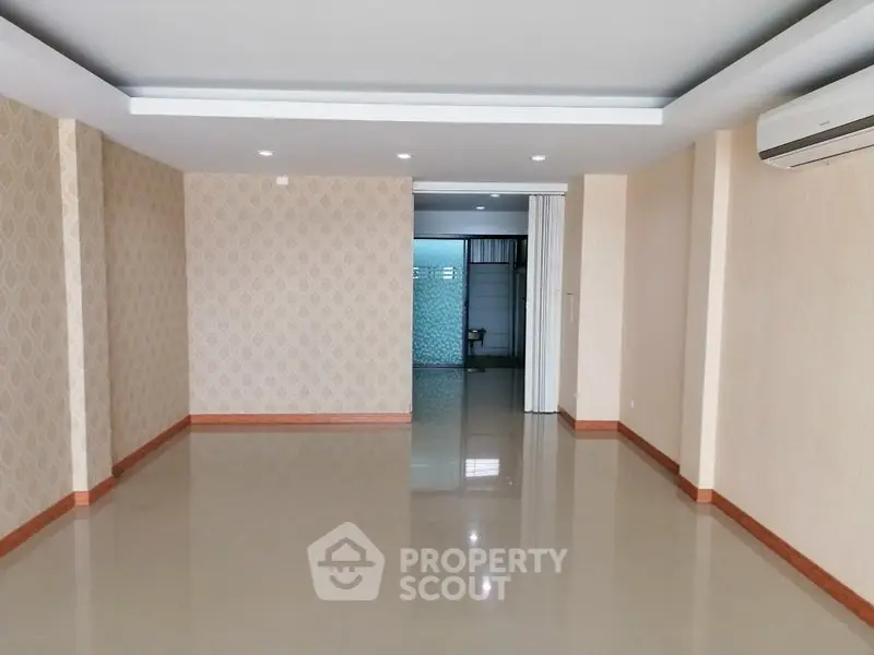 Spacious empty living room with modern design and air conditioning