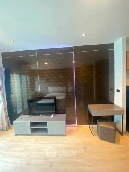 Modern living room with sleek furniture and stylish decor in a contemporary apartment.