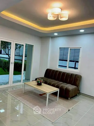 Modern living room with stylish lighting and garden view