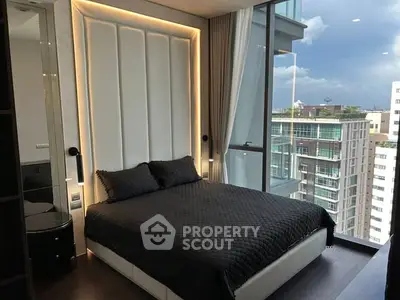 Luxurious modern bedroom with floor-to-ceiling windows offering stunning city views.