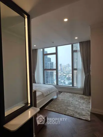 Luxurious bedroom with stunning city view and elegant decor