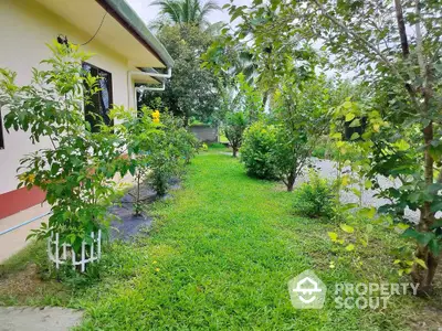 Charming garden view of a suburban home with lush greenery and trees