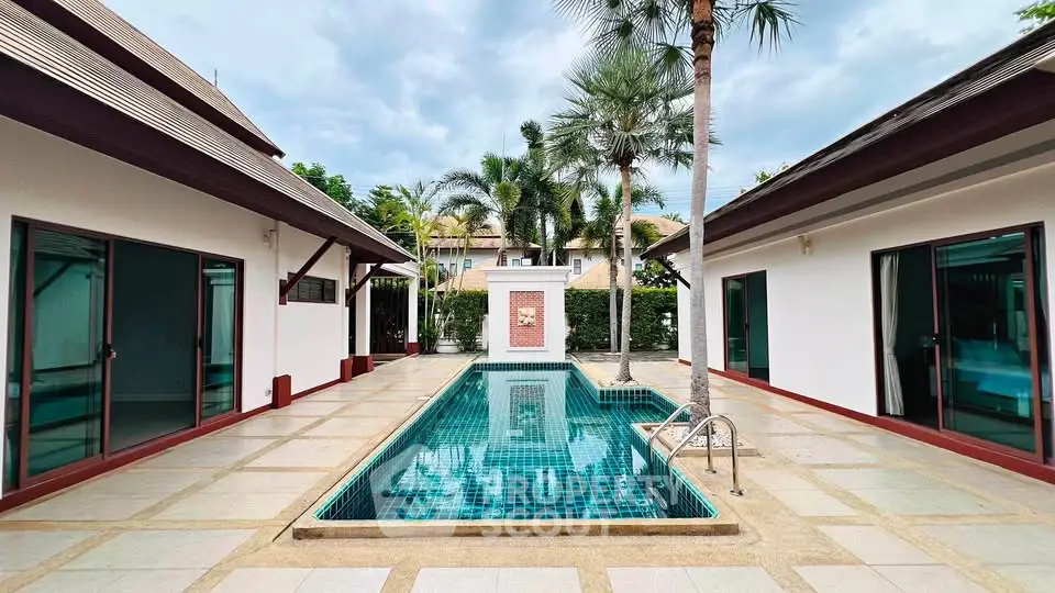 Luxurious villa with private pool and tropical landscaping, perfect for serene living.
