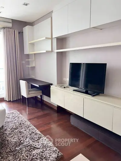 Modern living room with sleek TV setup and elegant furnishings