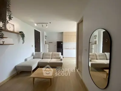 Modern living room with stylish decor and open kitchen layout