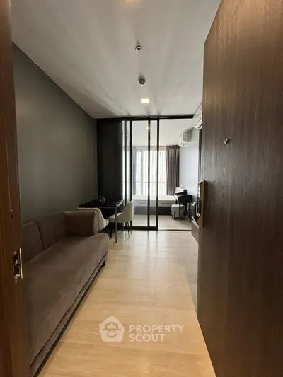 Modern apartment entrance with sleek design and cozy living area