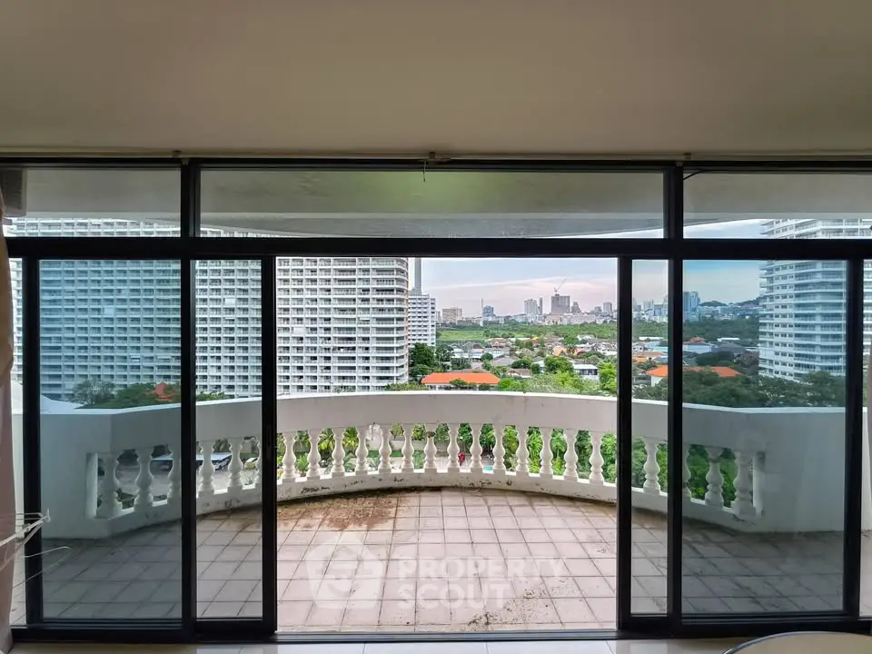 Spacious balcony with panoramic city view from high-rise apartment