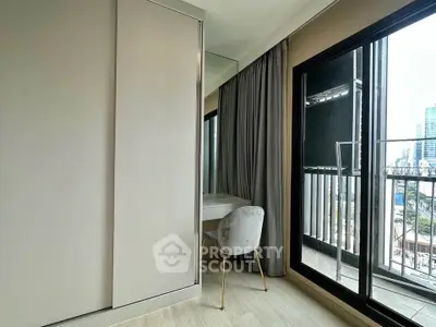 Modern bedroom with balcony view and stylish decor in urban apartment