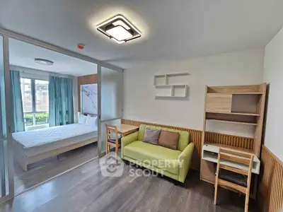 Modern studio apartment with sliding glass doors and stylish decor