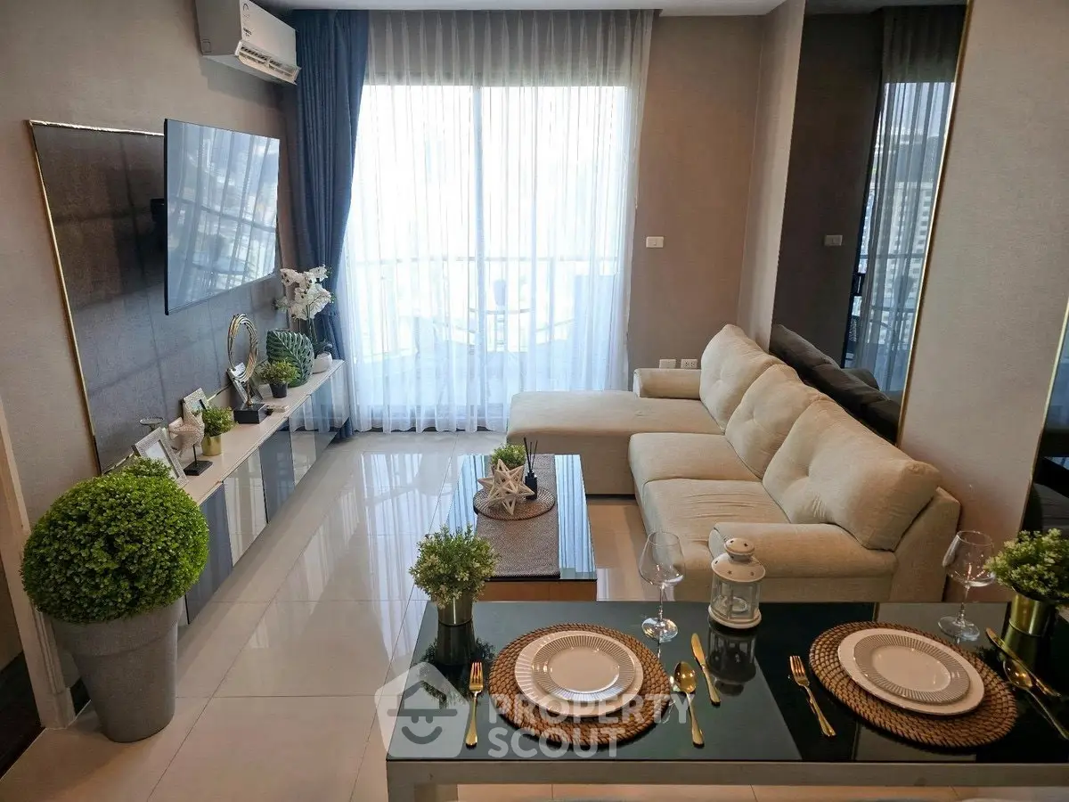 Modern living room with elegant decor and large window view