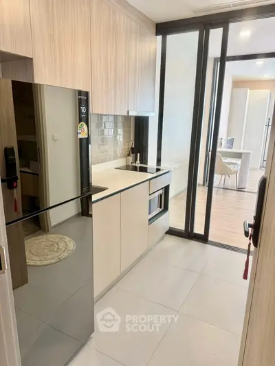 Modern kitchen with sleek appliances and open layout in stylish apartment